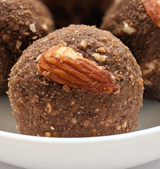 Cacao Almond Laddoos – Nutritious laddoos made with pure cacao and almonds, perfect for a guilt-free snack.